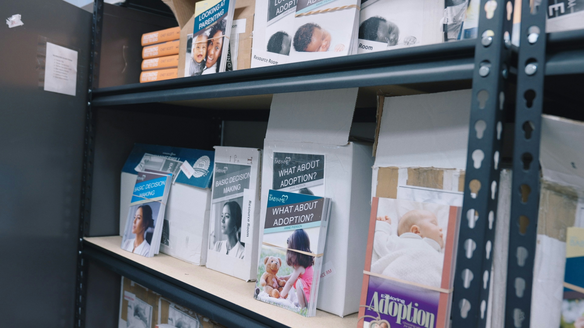 A shelf with pamphlets and resources in a clinic